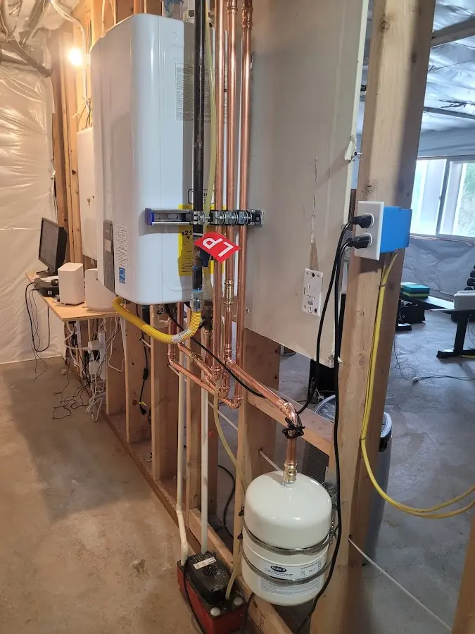 Licensed plumber repairing a kitchen sink in Litchfield